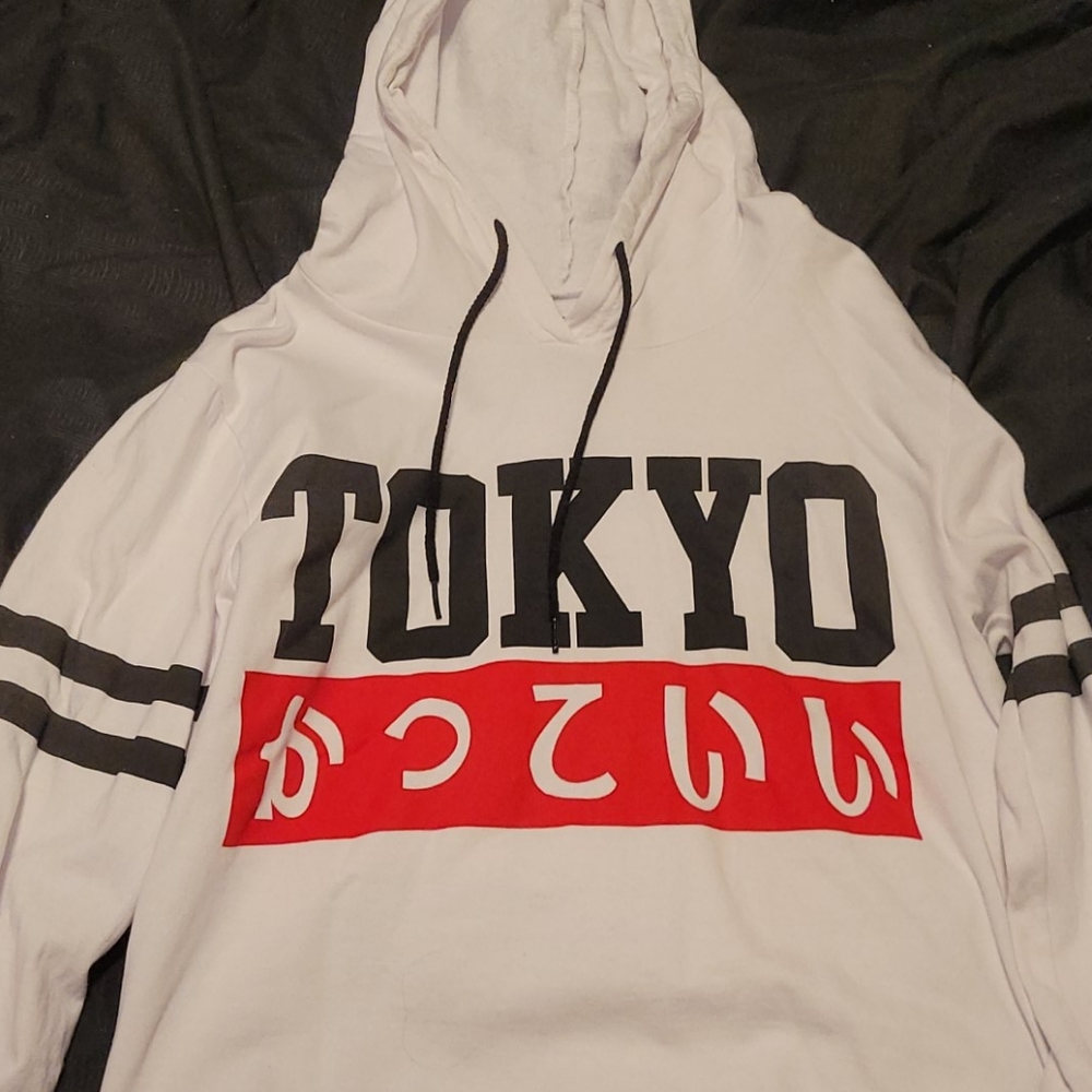 white shirt with black and red lettering